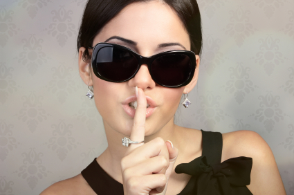 Woman with dark glasses being secretive and private