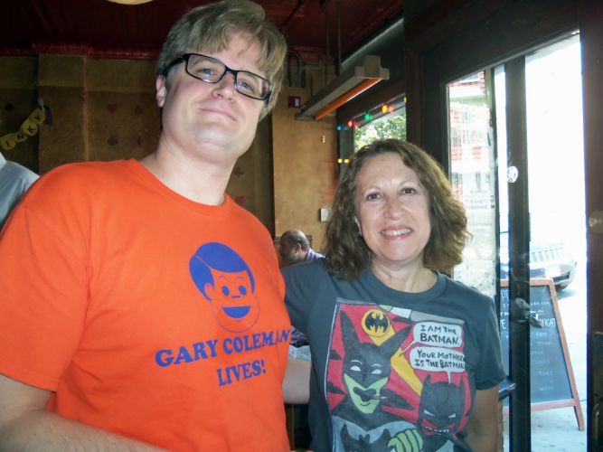 Geoff Mosher, cartoonist and Susan Newman, book designer, wearing Geoff's Batmen t-shirt